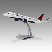 Delta Air Lines A220-300 model airplane on a gray background