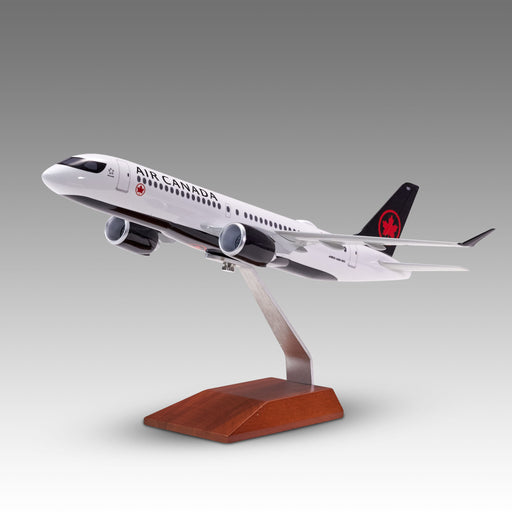 Air Canada A220-300 scale aircraft model on a wood base by Pacmin Studios showcasing the left side