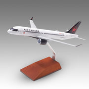Air Canada A220-300 scale aircraft model on a wood base by Pacmin Studios showcasing the top left