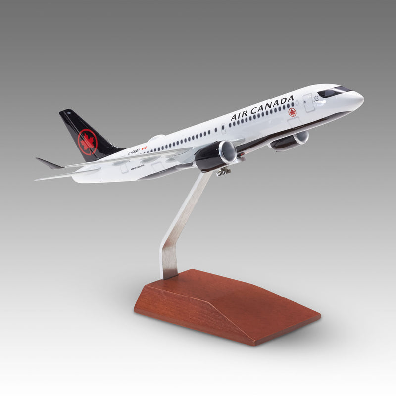 Air Canada A220-300 scale aircraft model on a wood base by Pacmin Studios showcasing the right side