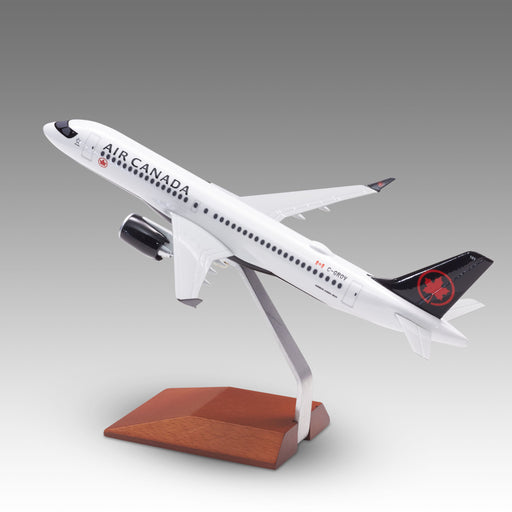 Air Canada A220-300 scale aircraft model on a wood base by Pacmin Studios showcasing the left side
